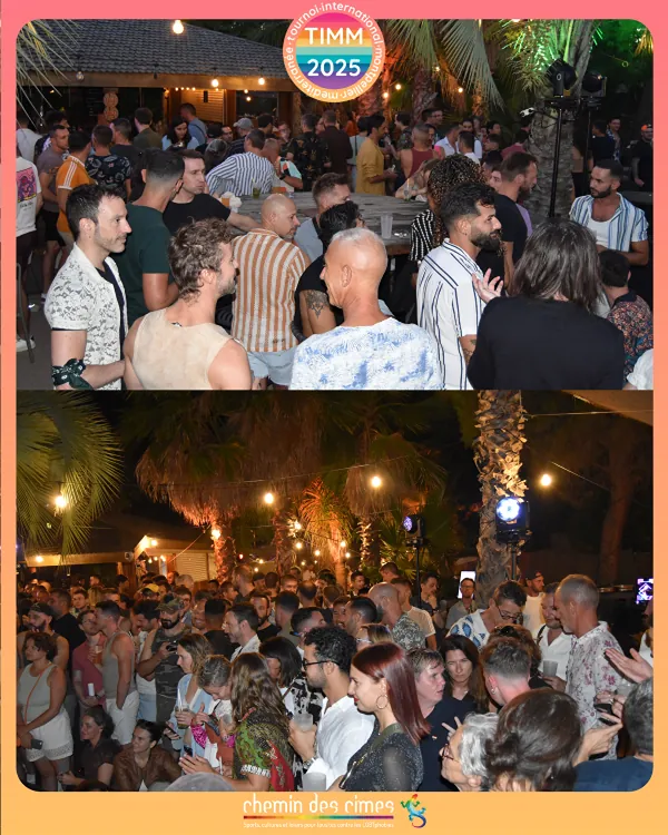 La foule de l'UL-TIMM Party danse sous les palmiers après la tombée de la nuit.
